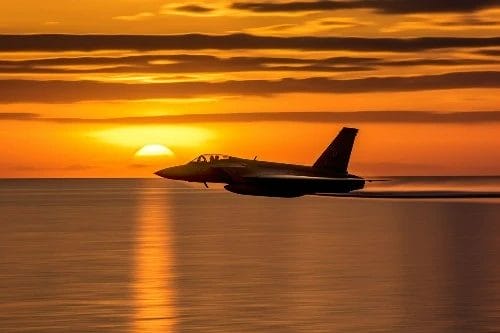 Fighter jet in sunset